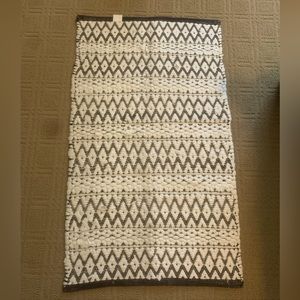 Black and white weaved rug
